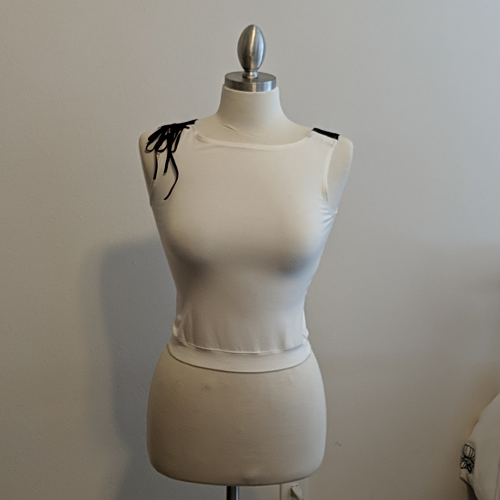 White shirt sleeveless with detailing on the side